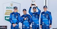 Acura drivers Scott Dixon, Felix Rosenqvist, Tom Blomqvist, and Colin Braun celebrate a second-place finish at the 2025 Rolex 24 at Daytona.