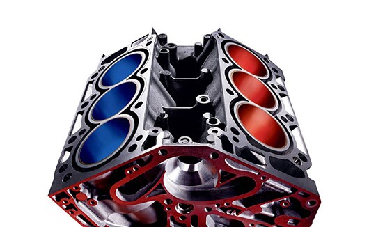 V-6 cylinder block with red cylinders on one bank, blue on the other.