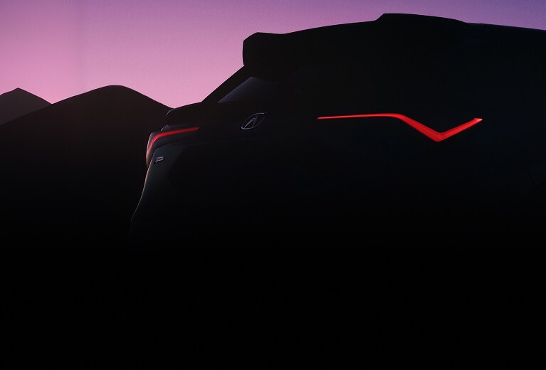 2026 Acura ADX A-spec back at sunset showing the A-Spec badge and chicane taillights (Premium Compact SUV). 2026 Acura ADX A-spec back at sunset showing the A-Spec badge and chicane taillights (Premium Compact SUV).
