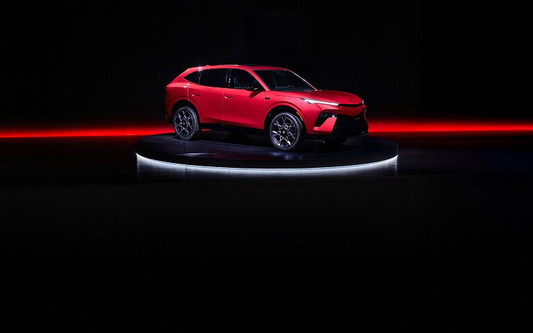2026 Acura Hybrid 7/8 front on a dark studio stage with red lighting accents. 2026 Acura Hybrid 7/8 front on a dark studio stage with red lighting accents.