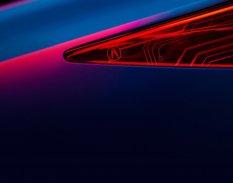 Close-up of an Acura front headlight.