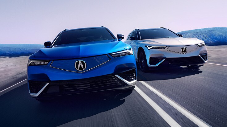 2024 Acura ZDX Type-S in Double Apex Blue Pearl and Frostline White Pearl, driving on a road (Premium All-Electric SUV).