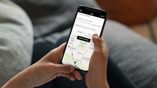Person browsing on Acura's retailer page on a mobile phone