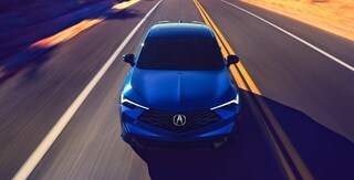 Acura 2025 ADX A-Spec with Advance Package in Adriatic Sea Blue Metallic front view on the road