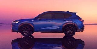 Acura 2025 ADX A-Spec with Advance Package in Adriatic Sea Blue Metallic side profile body lines and a tailgate spoiler