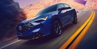 Acura 2025 ADX A-Spec with Advance Package in Adriatic Sea Blue Metallic on the road