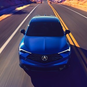 Acura 2025 ADX A-Spec with Advance Package in Adriatic Sea Blue Metallic front view on the road