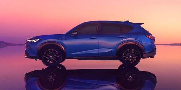 Acura 2025 ADX A-Spec with Advance Package in Adriatic Sea Blue Metallic side profile body lines and a tailgate spoiler
