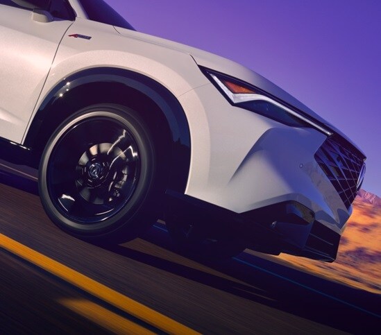 Acura 2025 ADX on the road with the headlights focused