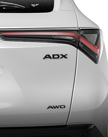 2026 Acura ADX shown in Platinum White Pearl featuring the Gloss Black Emblems accessories.