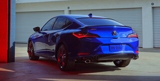 2025 Integra rear view driving on the road