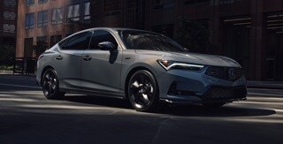 2026 Acura Integra 3/4 front view driving in Urban Gray Pearl.