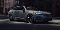 2026 Acura Integra 3/4 front view driving in Urban Gray Pearl.