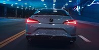 2026 Acura Integra in Urban Gray Pearl, rear view driving in a tunnel.