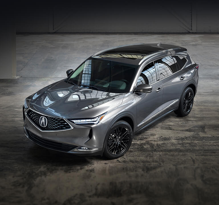 2022 Acura MDX Advance in Liquid Carbon Metallic in a warehouse