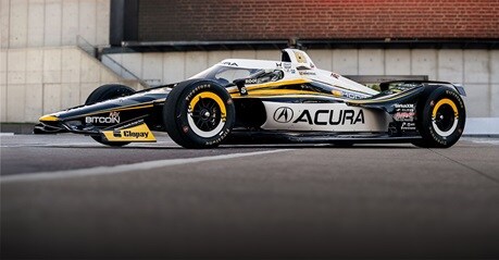 2026 Acura profile parked on the pavement of a professional outdoor racing track.